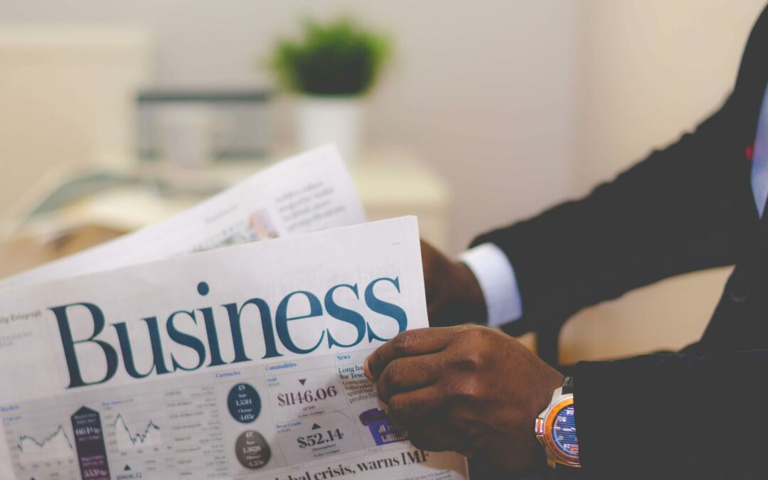 Man reading the business section of a newspaper